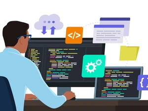 Man sitting in front of a PC and coding