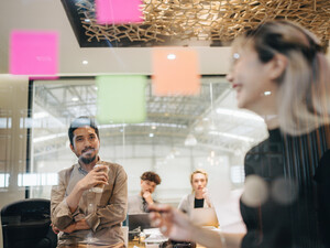 © iStock.com/staticnak1983
Source: iStock.com/staticnak1983 Team Scrum-style meeting using Post-it notes.